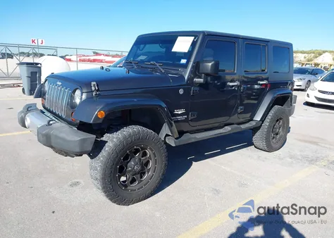 2010 Jeep Wrangler Unlimited Sahara z USA, uszkodzony, nr VIN 1J4BA5H16AL143044